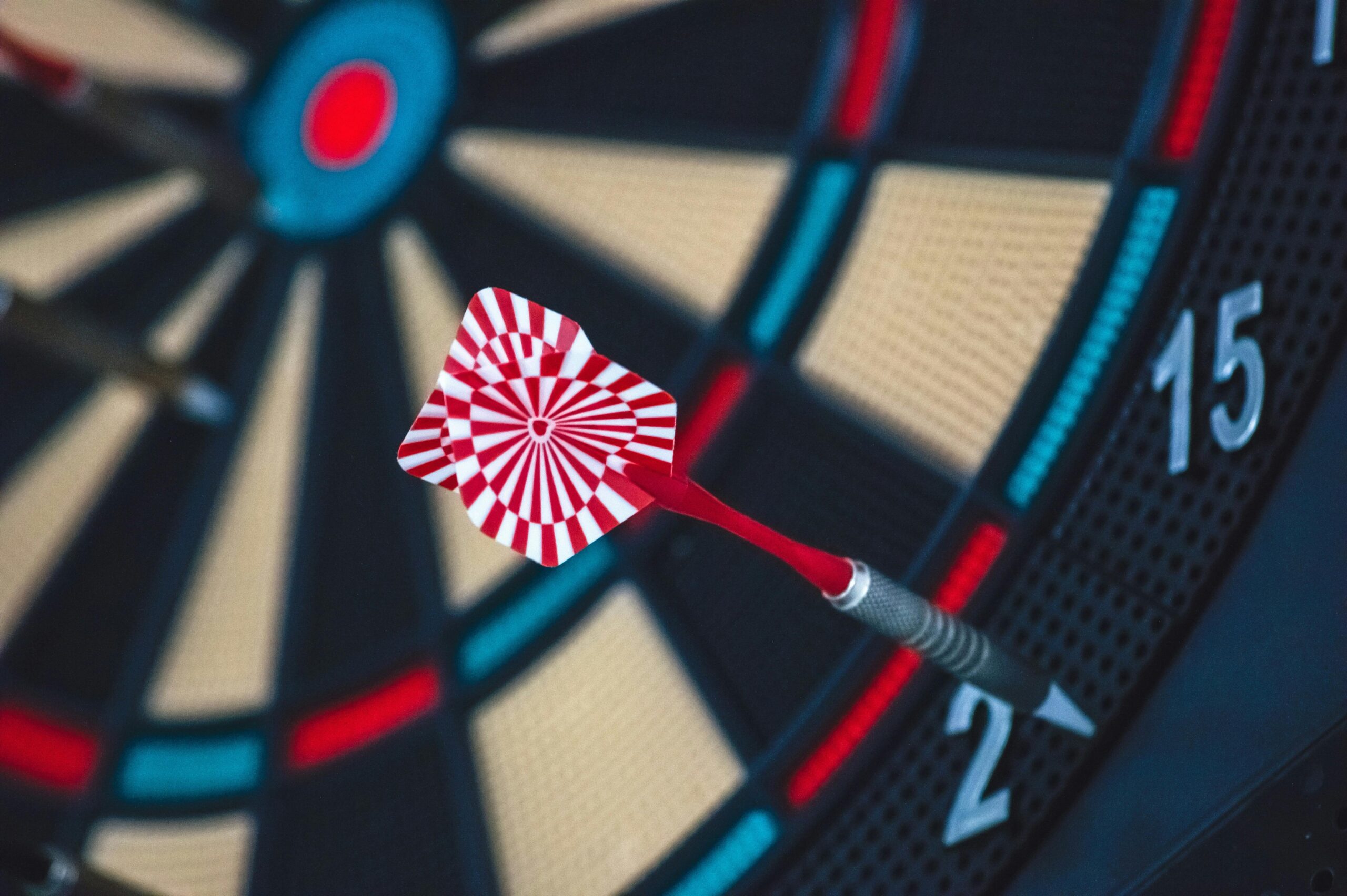 pexels-photo-262438-262438 A dart striking the bullseye on a dartboard, showcasing precision and accuracy.